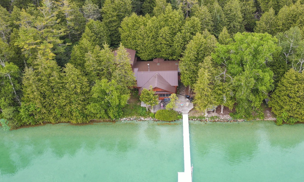 Presque Isle Cabin | Camp Windy Dock: Lakefront 5BR camp with dock, hot tub, fire pit, and kayak access.