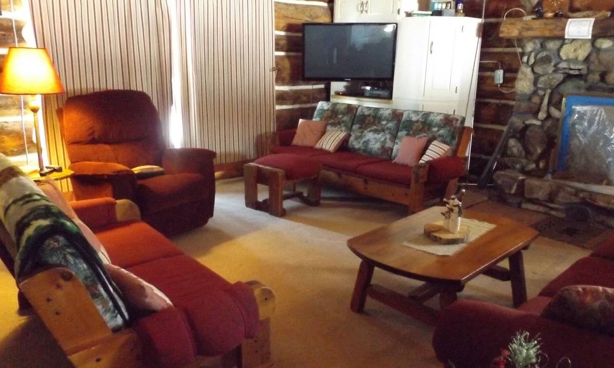 Perronville Cabin | Family friendly comfy log lodge and pond.