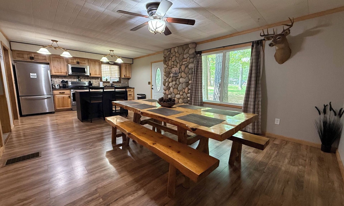 Prudenville Cabin | Knotty by Nature! Firepit and Parking! Less than a mile to trails and the lake!