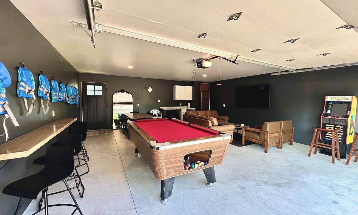 Prudenville House | Lakefront Home: Hot Tub, Paddle Boards, Game Room
