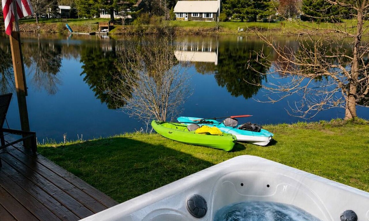 South Boardman Cabin | Welcome to Serenity Shores! 🌅 Soak in the private hot tub, unwind by the fire pit 🔥, and savor calming lake views. Pet-friendly 🐾 and perfect for recharging, exploring, and making memories.