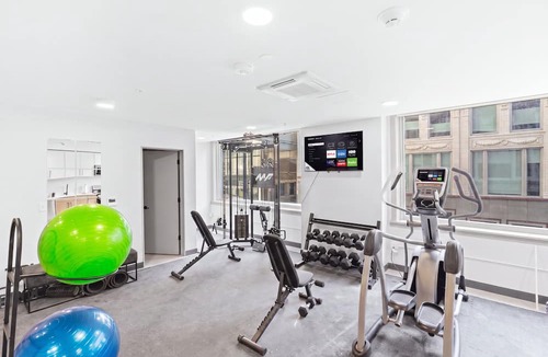 Financial District Apartment | Central Studio: Attached Garage | Rooftop | Gym