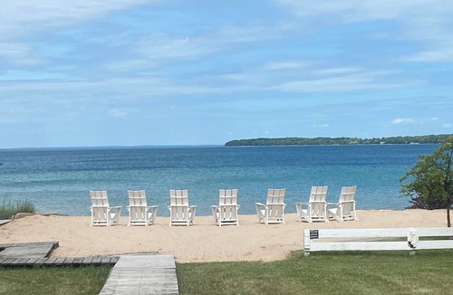 Suttons Bay Cottage | Quiet, Private, Waterfront - Luxury on 125 Ft. of Suttons Bay