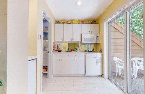 Maple City Condo | Upper-level condo with forest views, fireplace, soaking tub & high-speed WiFi