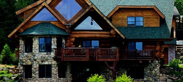 Beautiful handmade log home on private sand beach at the end of Big Bay in Tower