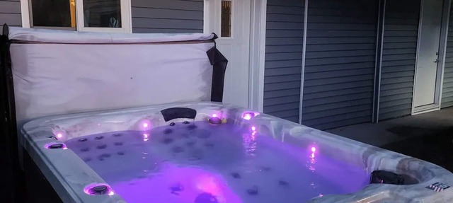 Cabin in Oscoda with hot tub and game room in Oscoda