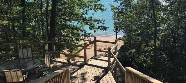 House is located on Lake Huron with a private beach in Harrisville