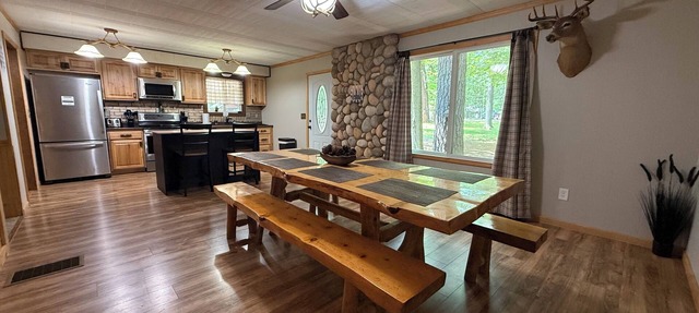 Knotty by Nature! Firepit and Parking! Less than a mile to trails and the lake! in Prudenville