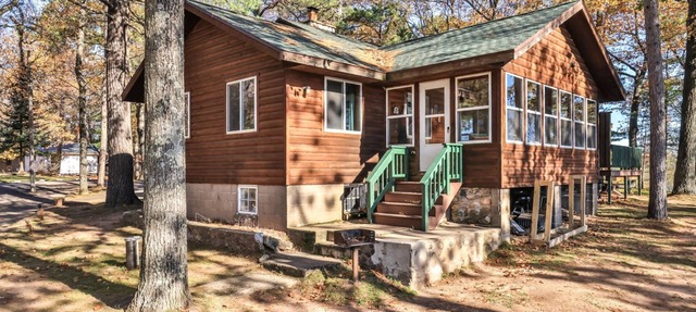 Lakeside resort cabin right on Little Saint with dock, sandy beach, firepit! in St.Germain