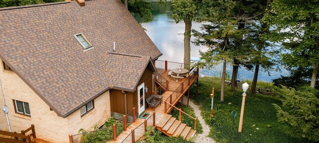 Loon's Lakehouse | Dock, Kayak Launch & Firepit in Lake Ann