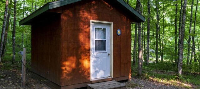 Rustic Cabin Nestled in the Trees for a Unique Outdoor Experience in White Lake, Wisconsin in White Lake