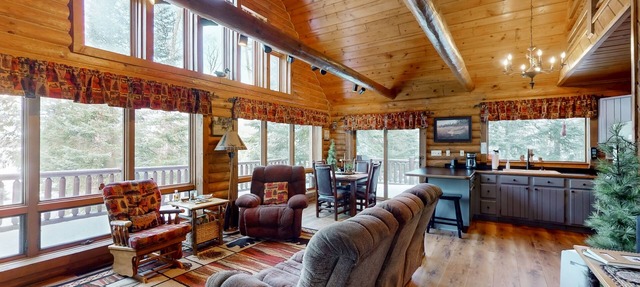 Spacious and beautiful lakefront log home on 7 acres with private dock in Presque Isle
