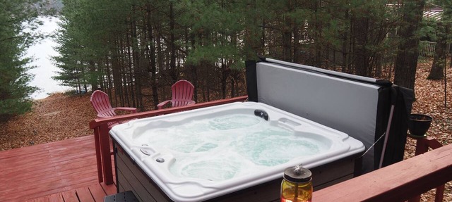 The Cub Hill Chalet on Cub Lake - Private Lakefront, Dock, Raft, Water Toys, Huge Deck, and Spa! in Kalkaska