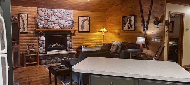 Waterfront log home on Lake Bellaire. Pet friendly. Fireplace, dock. Dog ok in Bellaire