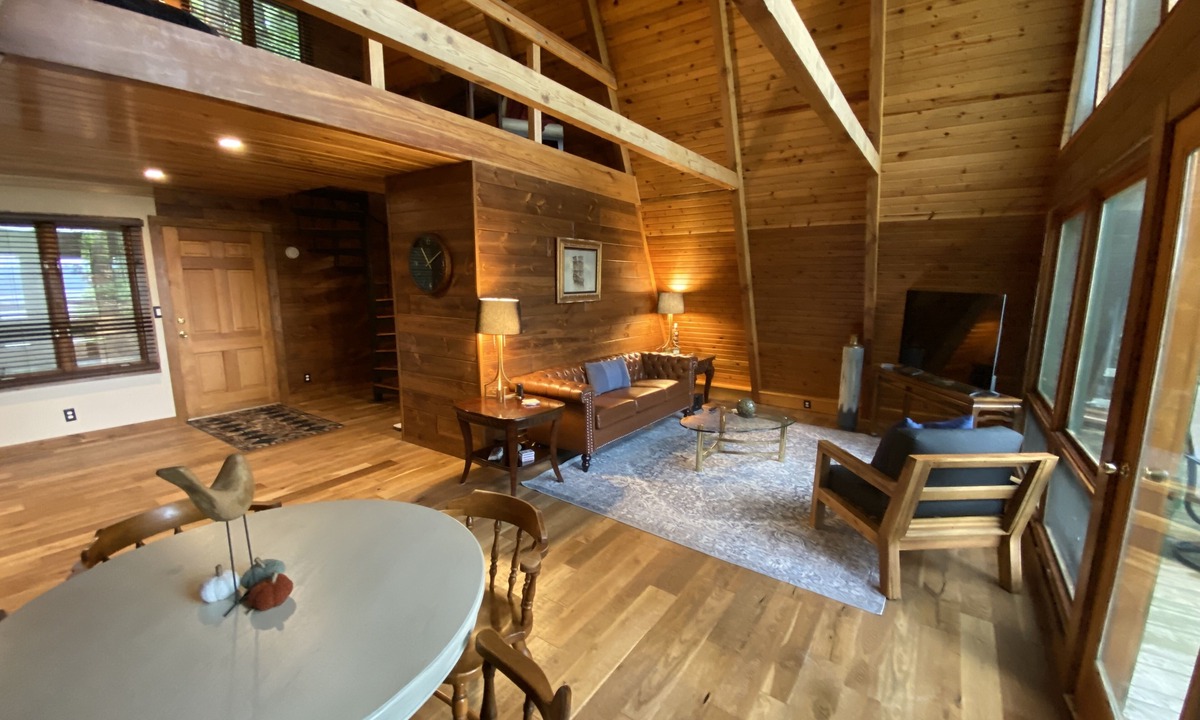 Allegan House | A-frame cabin nestled in forest, stunning lake view, perfect serenity.
