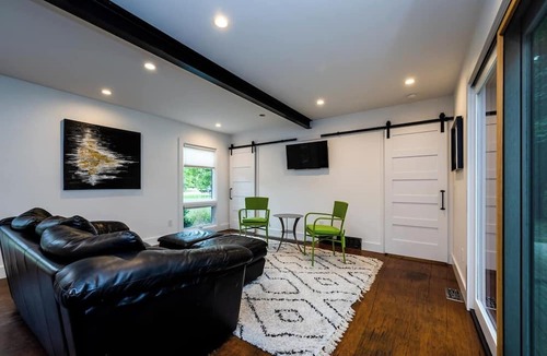 Benton Harbor Apartment | Unique container home retreat near Lake Michigan. Enjoy a peaceful, private setting with a spacious deck, firepit, and ravine views. Close to beaches, wineries, and downtown St. Joseph—perfect for a relaxing Southwest Michigan getaway.